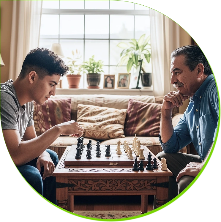 Intergenerational chess game - young man making a move while older man observes thoughtfully