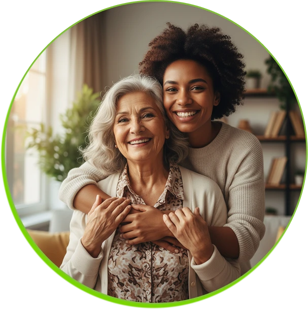Smiling older woman with grey hair embraced by younger Black woman with curly hair